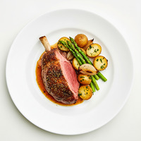 Baked herb marinated roasted leg of lamb