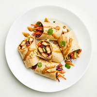 Authentic chicken tikka wrap with cos lettuce, tomato, Spanish onions, cucumber, paneer, & mint yoghurt