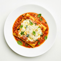 Ricotta spinach cannelonni - rich tomato sauce - fried basil - parmesan