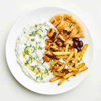 Khyar bi laban, garlic labneh, cucumber, sesame dressing, aleppo and shallot oil, flat bread